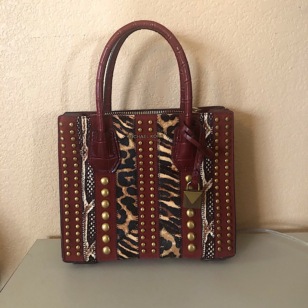 Small Michael Kors hand bag.  Excellent condition.